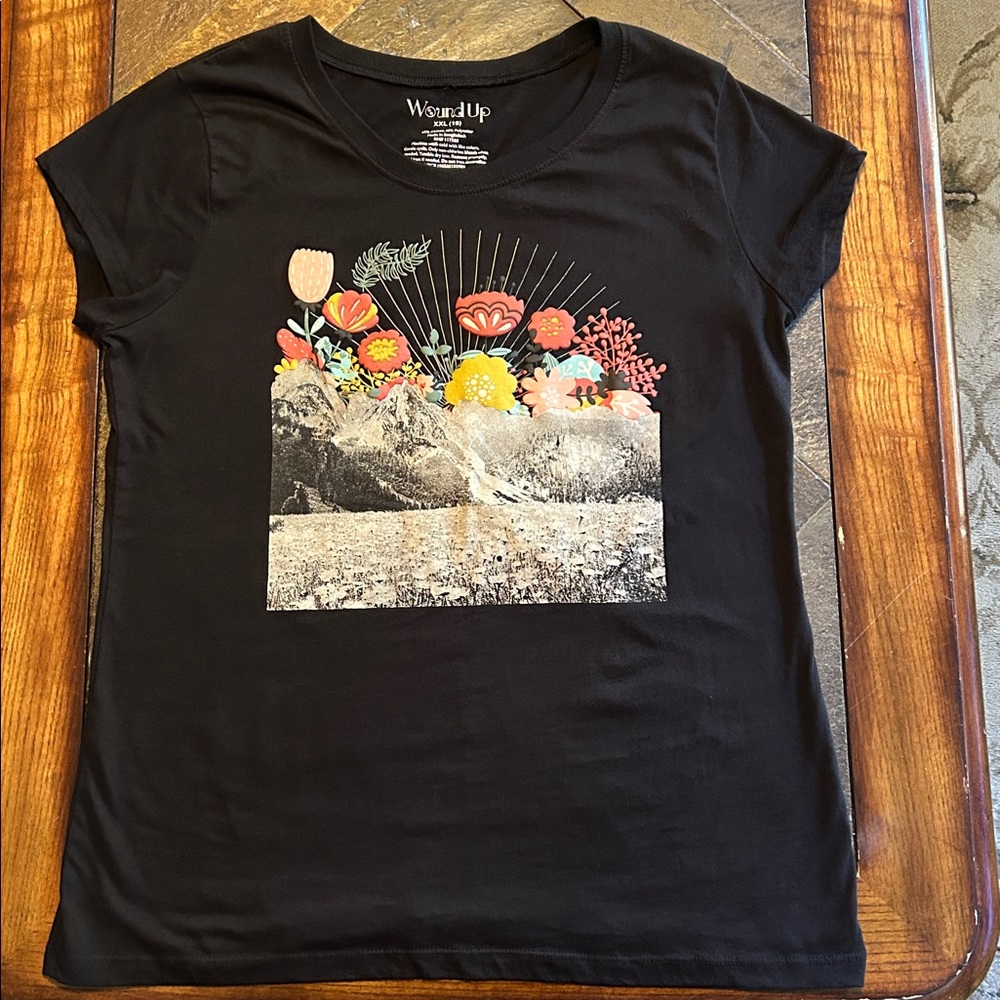 Wound Up black graphic tee with funky colorful flower, black and white mtn scene